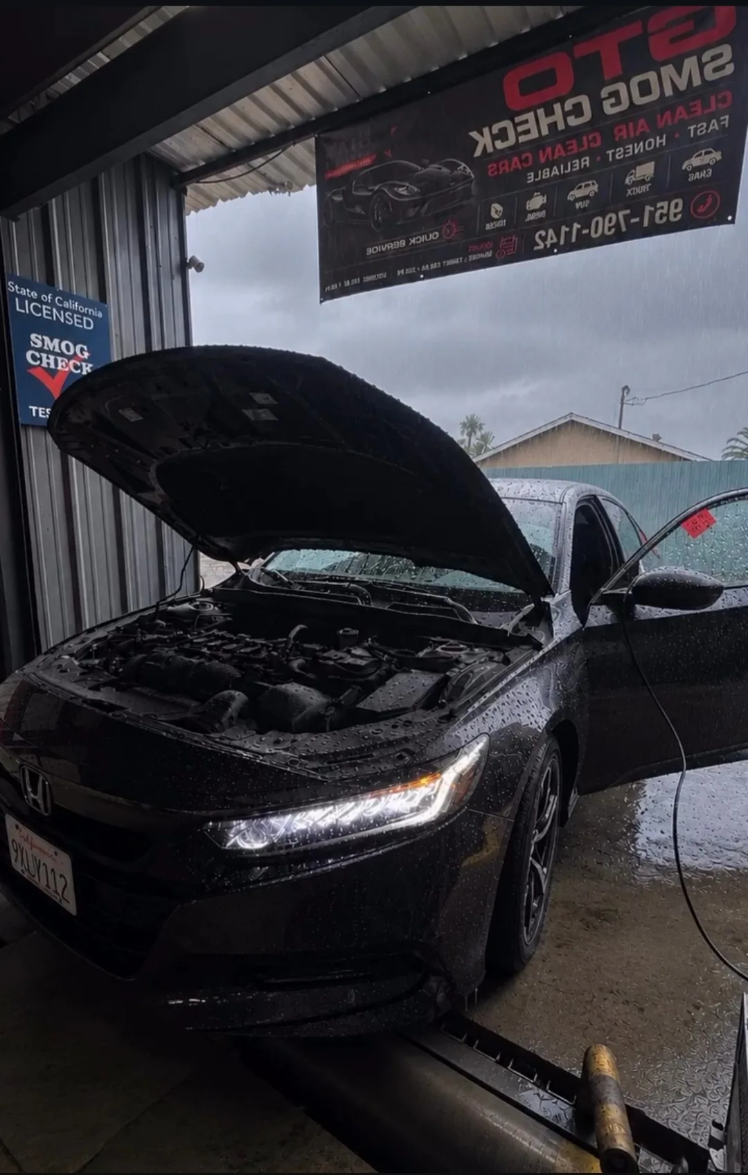 Vehicle positioned at a GTO Smog Check testing bay